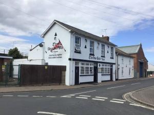 a white building on the side of a street at Travellers' Choice in Harwich-Essex in Harwich