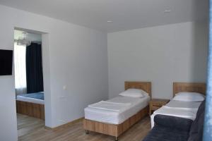 A bed or beds in a room at жули