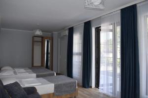 A bed or beds in a room at жули