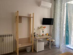 TV a/nebo společenská místnost v ubytování Titi Rooms