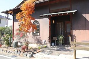 a house with a bench in front of it at Fuefuki - House - Vacation STAY 10281 in Fuefuki