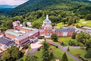 an aerial view of a campus with a building at Jackson River Estate Cozy Cottage on the River in Covington