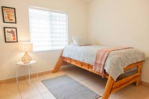 A bed or beds in a room at Beautiful House in Playas de Tijuana.