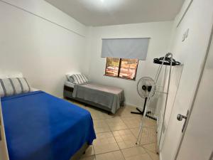 Postel nebo postele na pokoji v ubytování Ap 202 Tmo Hospedagem