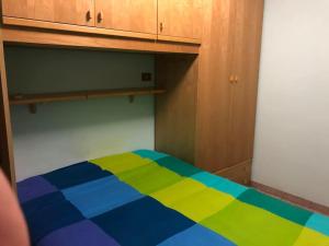 Ένα ή περισσότερα κρεβάτια σε δωμάτιο στο La Mansarda del cuore