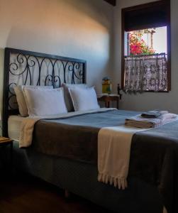 Cama ou camas em um quarto em Moã Charme Hotel - Mucugê