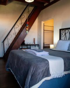 Cama ou camas em um quarto em Moã Charme Hotel - Mucugê
