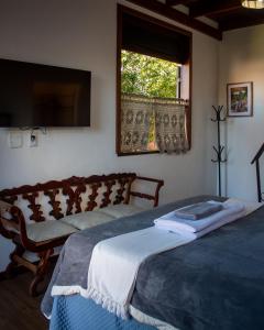 Cama ou camas em um quarto em Moã Charme Hotel - Mucugê