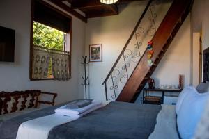 Cama ou camas em um quarto em Moã Charme Hotel - Mucugê