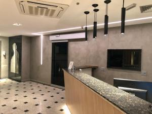 a lobby with a bar in a building at Hotel Sheik (Adults Only) in Rio de Janeiro