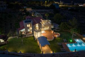 an aerial view of a house with a swimming pool at Villa Damant in Pithárion