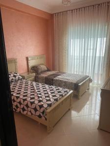 Postel nebo postele na pokoji v ubytování Appartement De Luxe A Wilaya De Tetouan