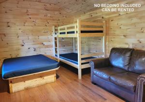 a living room with a couch and a bunk bed at Tobermory Village Cabins in Tobermory