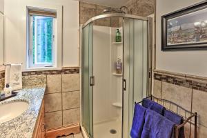 a bathroom with a shower and a sink at Northern Star - Main House in Fairbanks +17 photos
