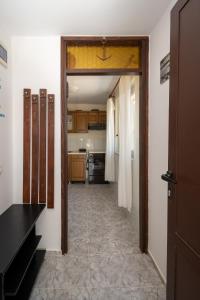 a hallway leading to a kitchen with a door open at Apartments by the sea Vinjerac, Zadar - 21399 in Vinjerac