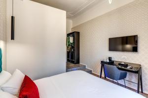 Postel nebo postele na pokoji v ubytování Arenula Suites