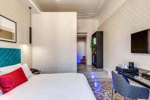 Postel nebo postele na pokoji v ubytování Arenula Suites