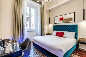 Postel nebo postele na pokoji v ubytování Arenula Suites