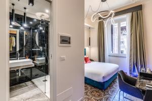 Postel nebo postele na pokoji v ubytování Arenula Suites
