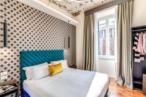 Postel nebo postele na pokoji v ubytování Arenula Suites