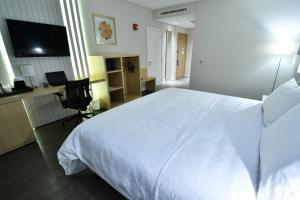 Voodi või voodid majutusasutuse Holiday Inn Express Asuncion Aviadores by IHG toas