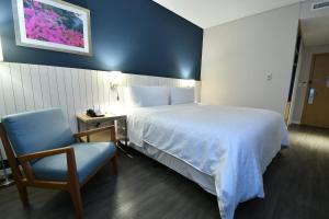 Voodi või voodid majutusasutuse Holiday Inn Express Asuncion Aviadores by IHG toas