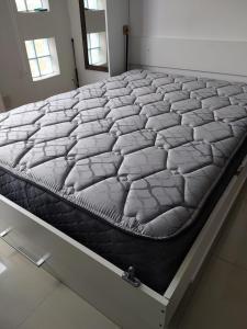 a mattress on a bed frame in a room at Luz de Faro, frente a las playas mas lindas! in Mar del Plata