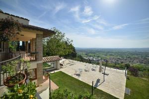 a view from the balcony of a house with a garden at Villa Clara in Assisi