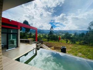 a house with a swimming pool with a view at Chalet Cerinza by Malaver in Cerinza