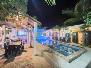 a villa with a swimming pool at night at Casa Halley #2 con vista al mar , Playas in Data de Posorja