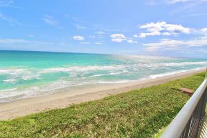 a view of the ocean from a balcony of a beach at Ocean Breeze Condo in Jensen Beach