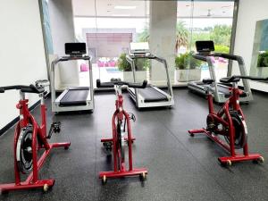 a gym with several exercise bikes in a room at Amazing Apt. Close to the City in Panama City