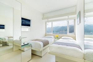 Letto o letti in una camera di Regal Riverside Hotel