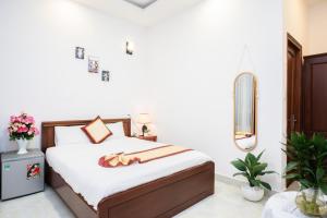 Postel nebo postele na pokoji v ubytování Tuấn An Hotel