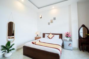 Postel nebo postele na pokoji v ubytování Tuấn An Hotel