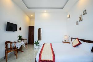 Postel nebo postele na pokoji v ubytování Tuấn An Hotel