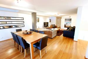 a dining room and living room with a table and chairs at Apt 8 'Aquilla' @ Bay View Centro, Dunsborough in Dunsborough