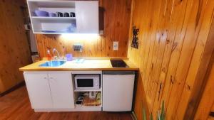 Kuchyň nebo kuchyňský kout v ubytování Cabañas Pulmahue