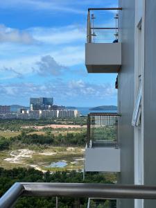 a balcony of a building with a view of a city at Sihanouk City View Condominium in Sihanoukville