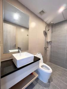 a bathroom with a sink and a toilet at Sihanouk City View Condominium in Sihanoukville
