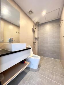 a bathroom with a toilet and a sink and a shower at Sihanouk City View Condominium in Sihanoukville