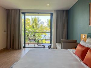 Postel nebo postele na pokoji v ubytování Marina Bay Vung Tau Resort & Spa + 117 fotografií