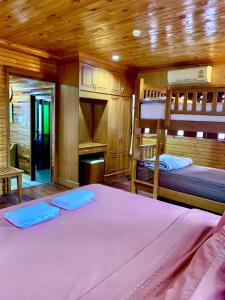 Postel nebo postele na pokoji v ubytování Baan Soontree Resort