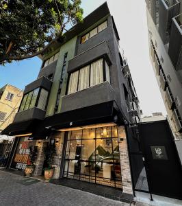 a store front of a building on a street at Levinski Market Hotel in Tel Aviv