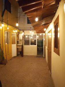 an empty hallway of a building with lights on it at Casita del Árbol in Mexico City