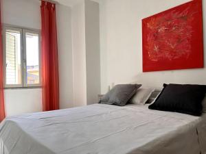 A bed or beds in a room at Casa Viola di Maria Gabriella, San Vito a 25 minuti da Costa Rey e Villasimius