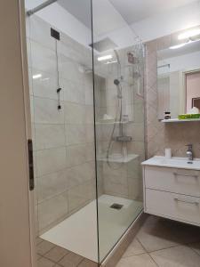 a shower with a glass door in a bathroom at Agape in Marco Simone +19 photos