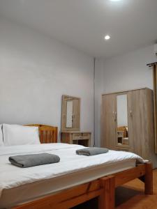 Postel nebo postele na pokoji v ubytování Sakura House
