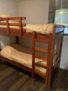 a couple of bunk beds in a room at Agradable Dp San Alfonso del Mar in Algarrobo