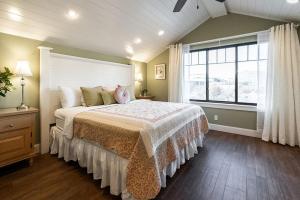 a bedroom with a large bed and a window at Aspenwood Manor in Provo